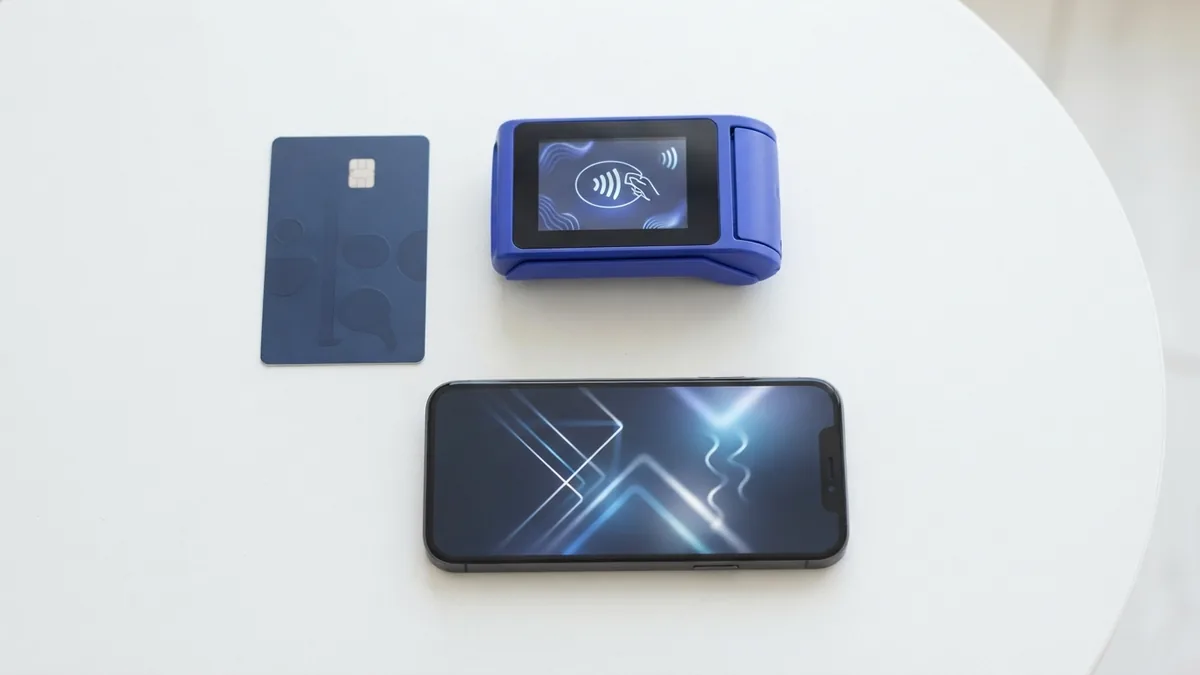 Card, phone, and contactless device showing common online payment methods
