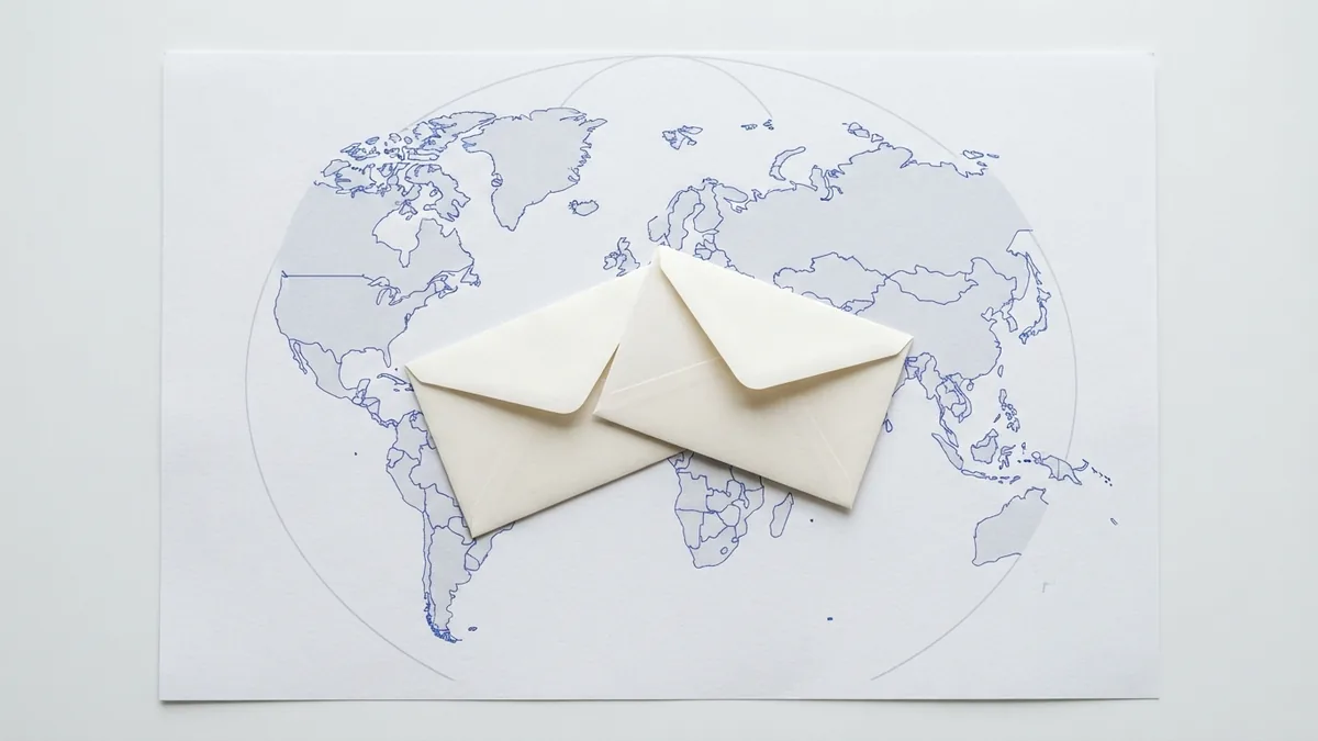 Banking envelopes placed on a world map to suggest a safe cross-border payment